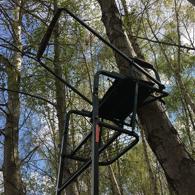 Galvanised adjustable highseat hunting tree stand by DALE, with a sturdy platform and safety straps for secure wildlife observation.