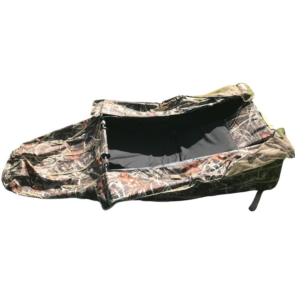 DALE pop-up wildfowl stubble camo lay-down ground blind set up in natural outdoor environment for hunting or birdwatching.