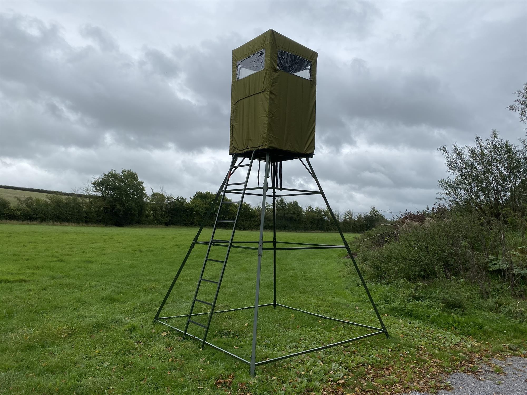 Dale covered double free-standing high seat hunting tower with water-resistant cover, enclosed design, and sturdy structure.