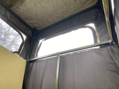 Covered double free-standing high seat hunting tower by DALE with water-resistant cover and enclosed design.