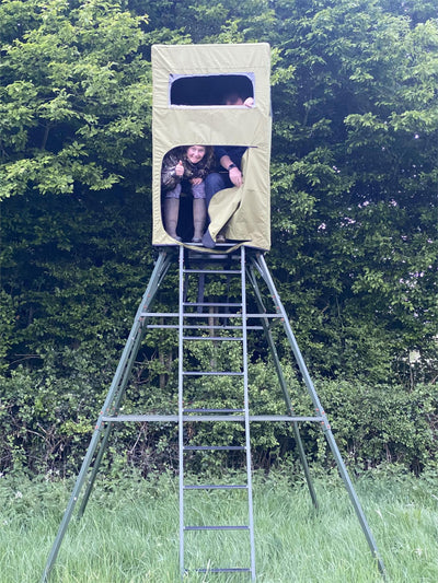 Covered double free-standing high seat hunting tower by DALE with water-resistant cover and enclosed design for outdoor wildlife observation.