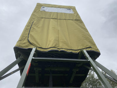 DALE covered double free-standing high seat hunting tower with water-resistant cover, enclosed for outdoor wildlife observation.