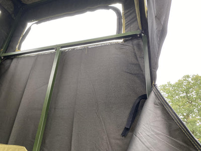 DALE covered double free-standing high seat hunting tower with water-resistant cover, enclosed design for outdoor hunting.