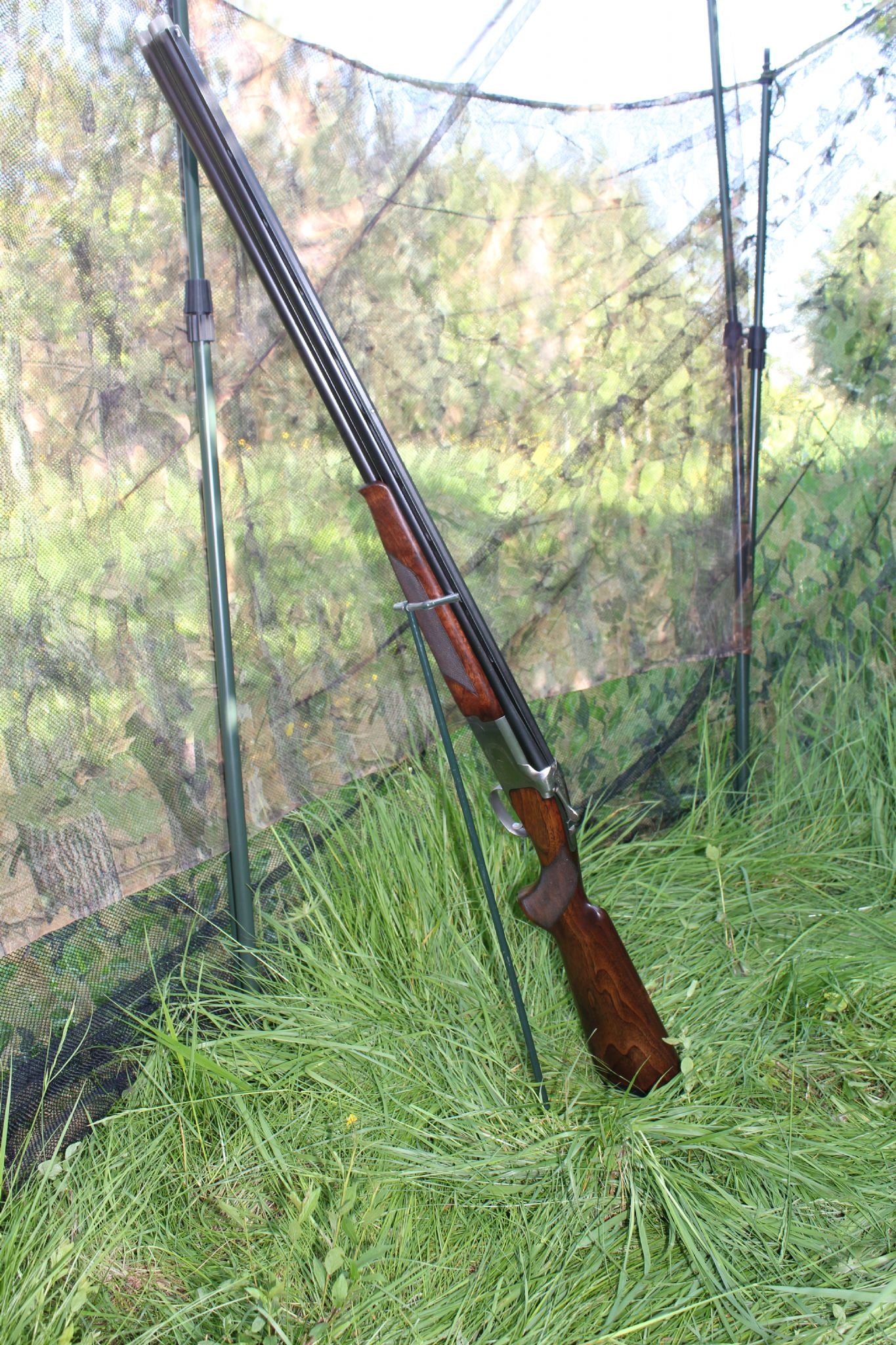 Echo gun stand for hide, durable black gun holder designed for secure storage of hunting rifles and shotguns.