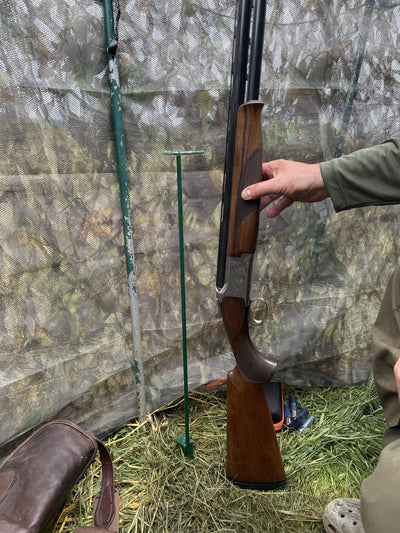 Echo gun stand for hunting hide, sturdy black plastic support for securing rifles or equipment in hunting blinds or hides.