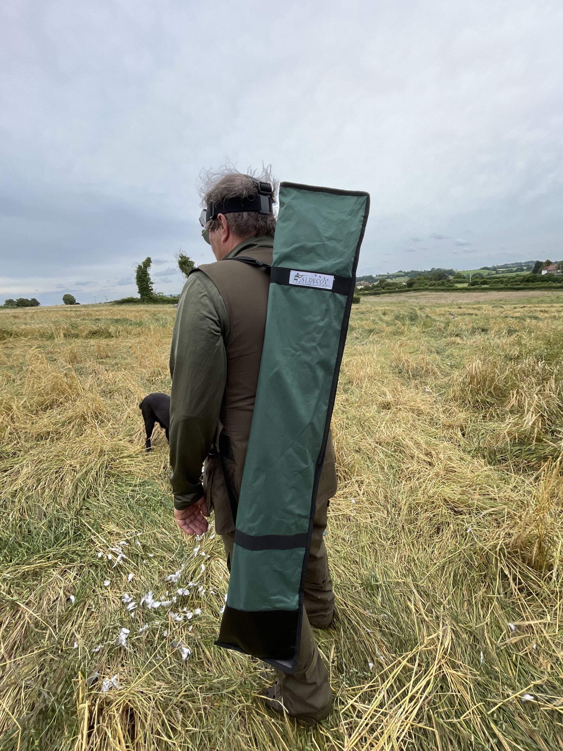 Echo heavy-duty hide poles kit with four green poles for outdoor hunting or trapping, sturdy and durable for rugged use.