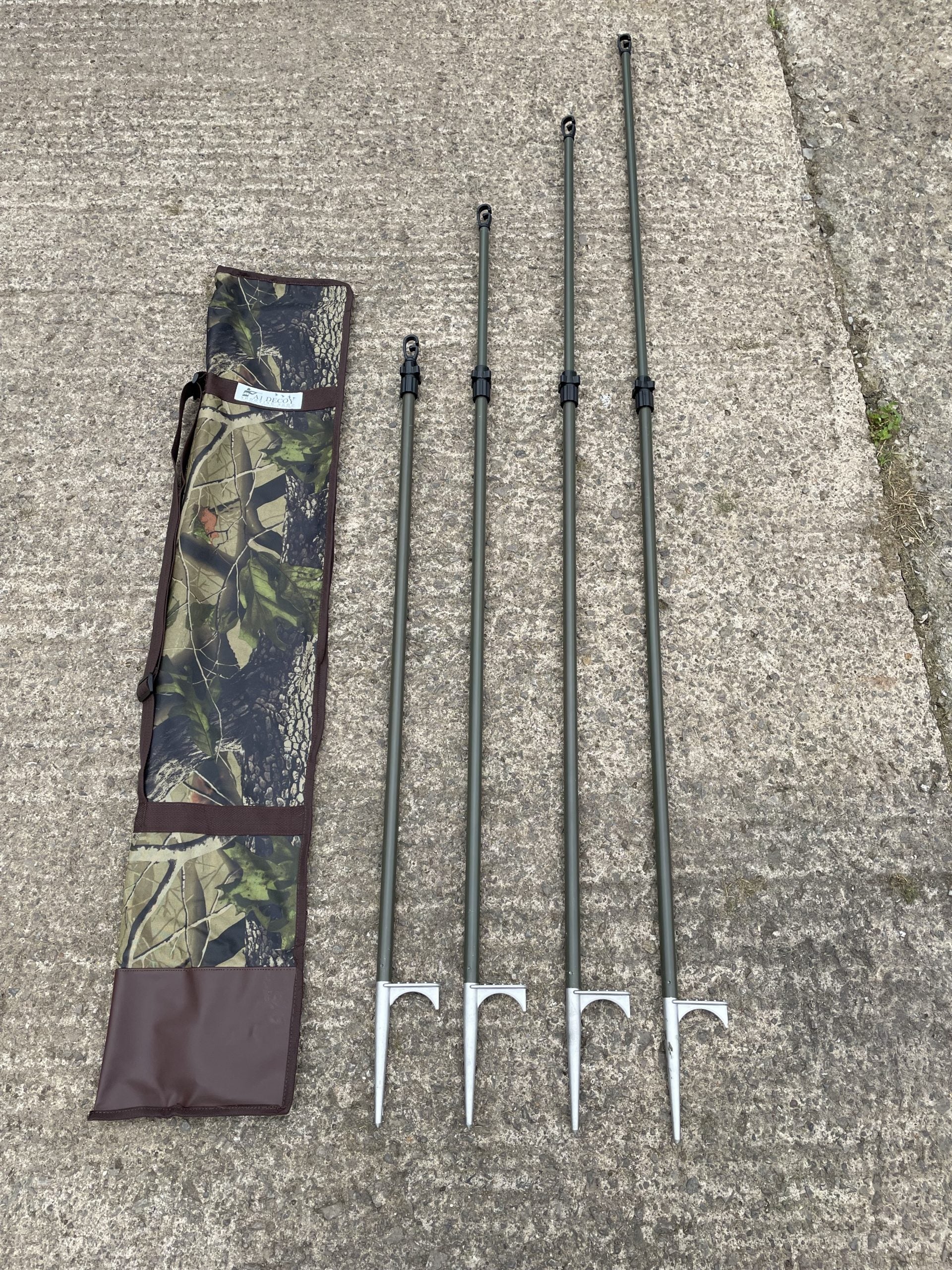 Echo heavy duty hide poles kit with four durable green poles for outdoor hunting or concealment use.