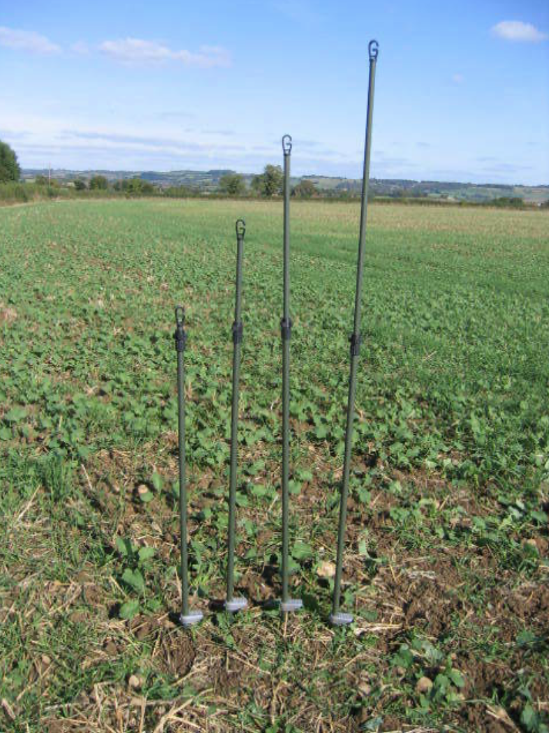 Echo green 4 single spike hide poles with camouflage or green canvas bag for outdoor hunting or wildlife observation.