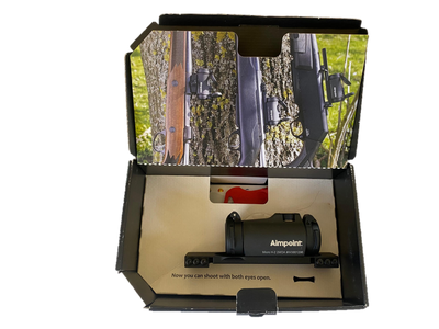 EDGAR Aimpoint H2 2MOA red dot sight mounted on Tikka T3 rifle with mount, close-up view of the sight and mounting system