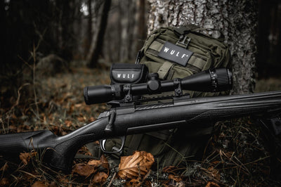 ELITE WULF Fireball 4-12x50 rifle scope with free dovetail mounts, featuring adjustable zoom and lens for precise targeting.