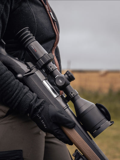 Hawke NocPix NITE D70R 4K Ultra Day and Night Digital Rifle Scope with laser rangefinder mounted on a rifle.