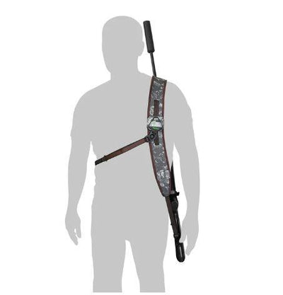 A person silhouette showcasing a camouflage patterned rifle sling designed for carrying a rifle comfortably.
