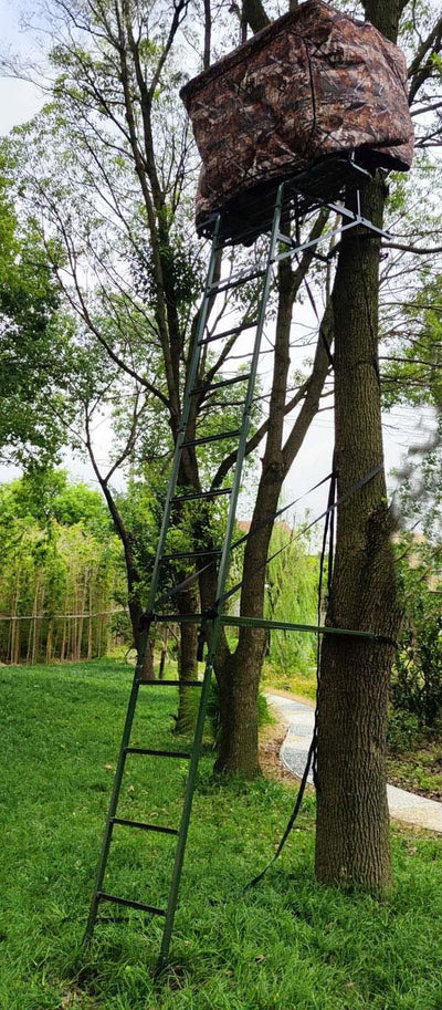 A camouflage-covered tree stand designed for hunting, attached to a tree with a ladder leading up to it.