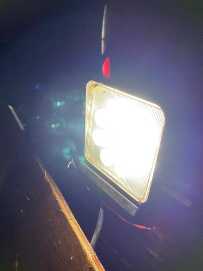Square vehicle work light by Monica, 18W high-powered LED work light for trucks and off-road vehicles.