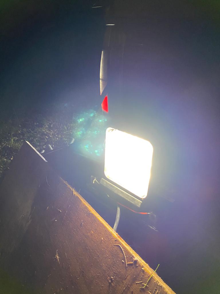 Square 18W high-powered vehicle work light by Monica with durable housing and bright LED illumination for outdoor use.