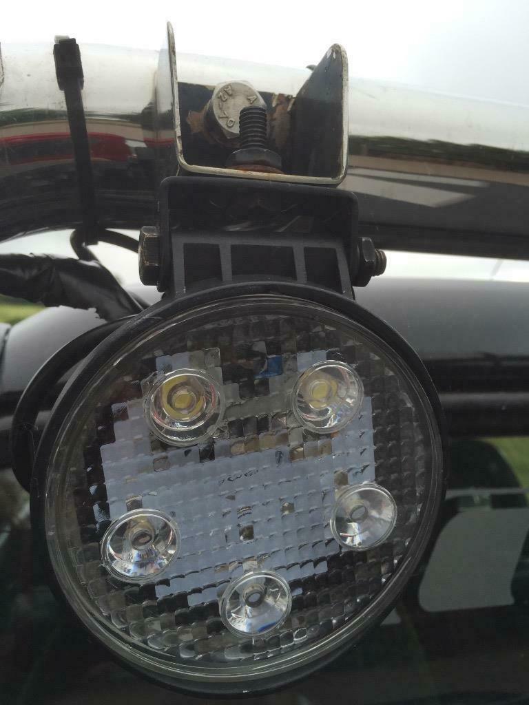 Square 18W high-powered vehicle work light by Monica, with bright LED illumination for outdoor or automotive use.
