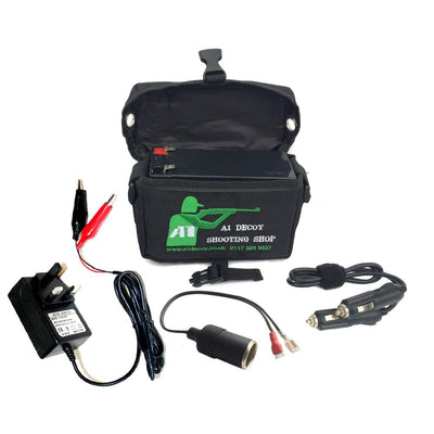 MONICA hunting lamp battery power kit showing batteries, charger, and accessories for outdoor hunting lighting equipment