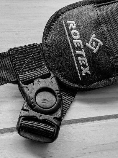 ROETEX Hunter Pro rifle sling attached to a firearm, adjustable strap with padding for comfortable carrying.