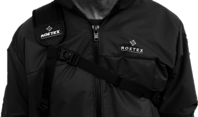 ROETEX Hunter Pro rifle sling shown on right shoulder, adjustable strap with padding for comfortable firearm carrying.