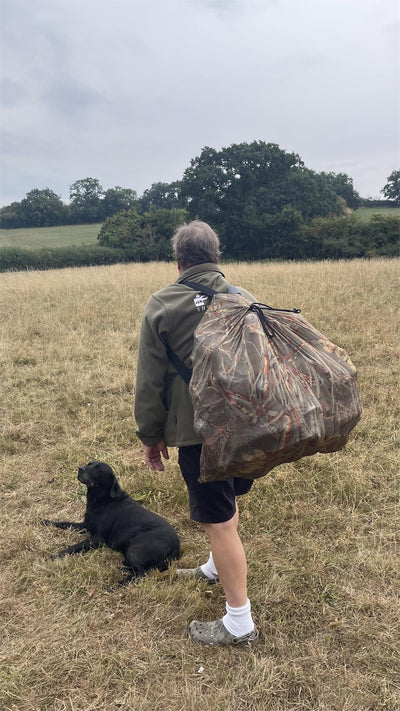 Simon camo mesh decoy bag with shoulder straps, designed for easy carrying and organized storage of hunting decoys.