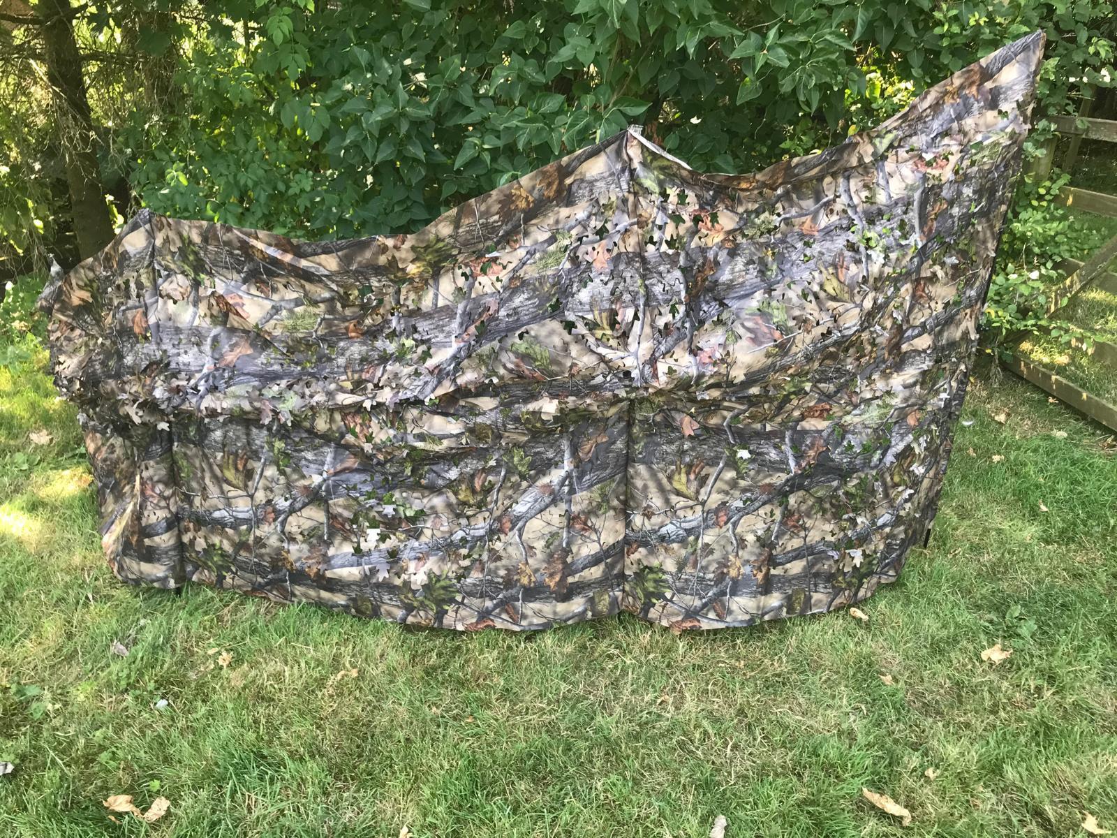 Telescopic pigeon hide in forest camo by SIMON, showing portable, collapsible design with camouflage fabric for birdwatching and hunting.