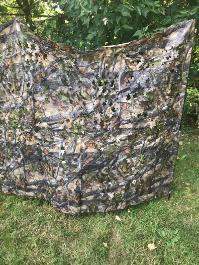 Telescopic pigeon hide in forest camouflage by SIMON, compact and portable for birdwatching and hunting in wooded areas.