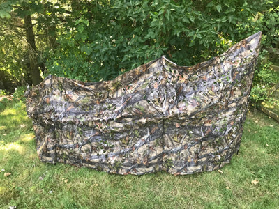 Telescopic pigeon hide in forest camouflage by SIMON, showing a portable, adjustable bird blind with camo fabric and collapsible design.