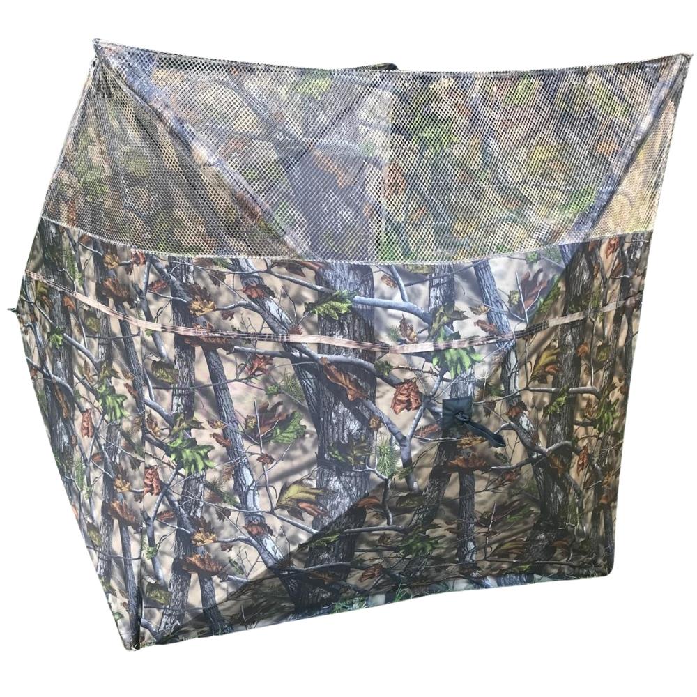 Simon pop-up hunting blind with three-sided stubble and wetland camo, ideal for pigeon shooting and outdoor wildlife concealment.