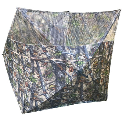 Simon pop-up hunting blind with three-sided stubble and wetland camo, ideal for pigeon shooting and outdoor wildlife concealment.