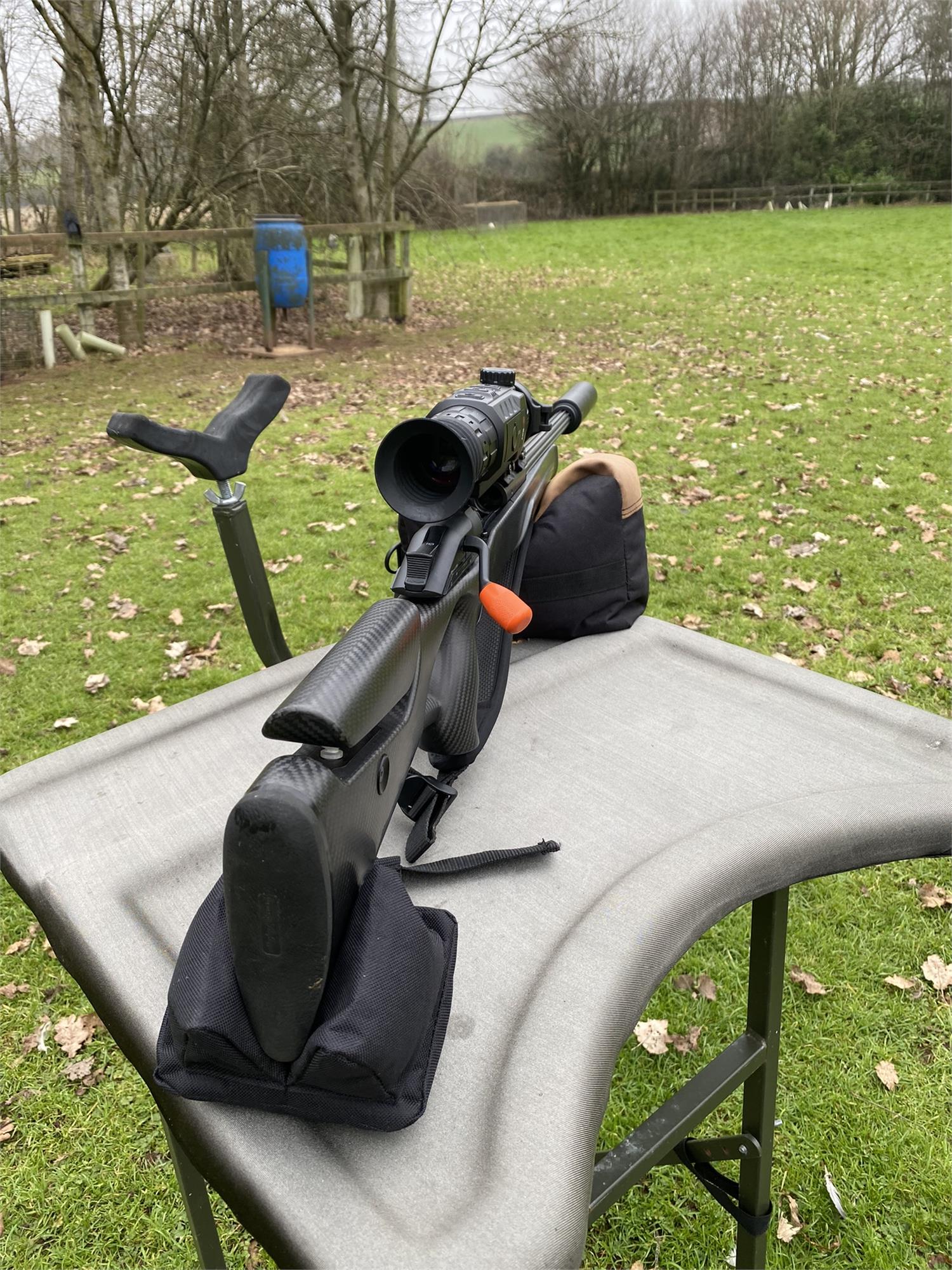 Simon black and brown two-piece rifle rest for stability and support during shooting or hunting activities.