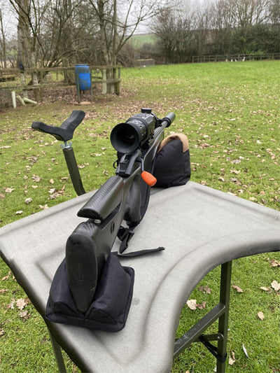 Simon black and brown two-piece rifle rest for stability and support during shooting or hunting activities.