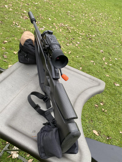 Simon black and brown two-piece rifle rest, unfilled, designed for stable firearm support in outdoor shooting.