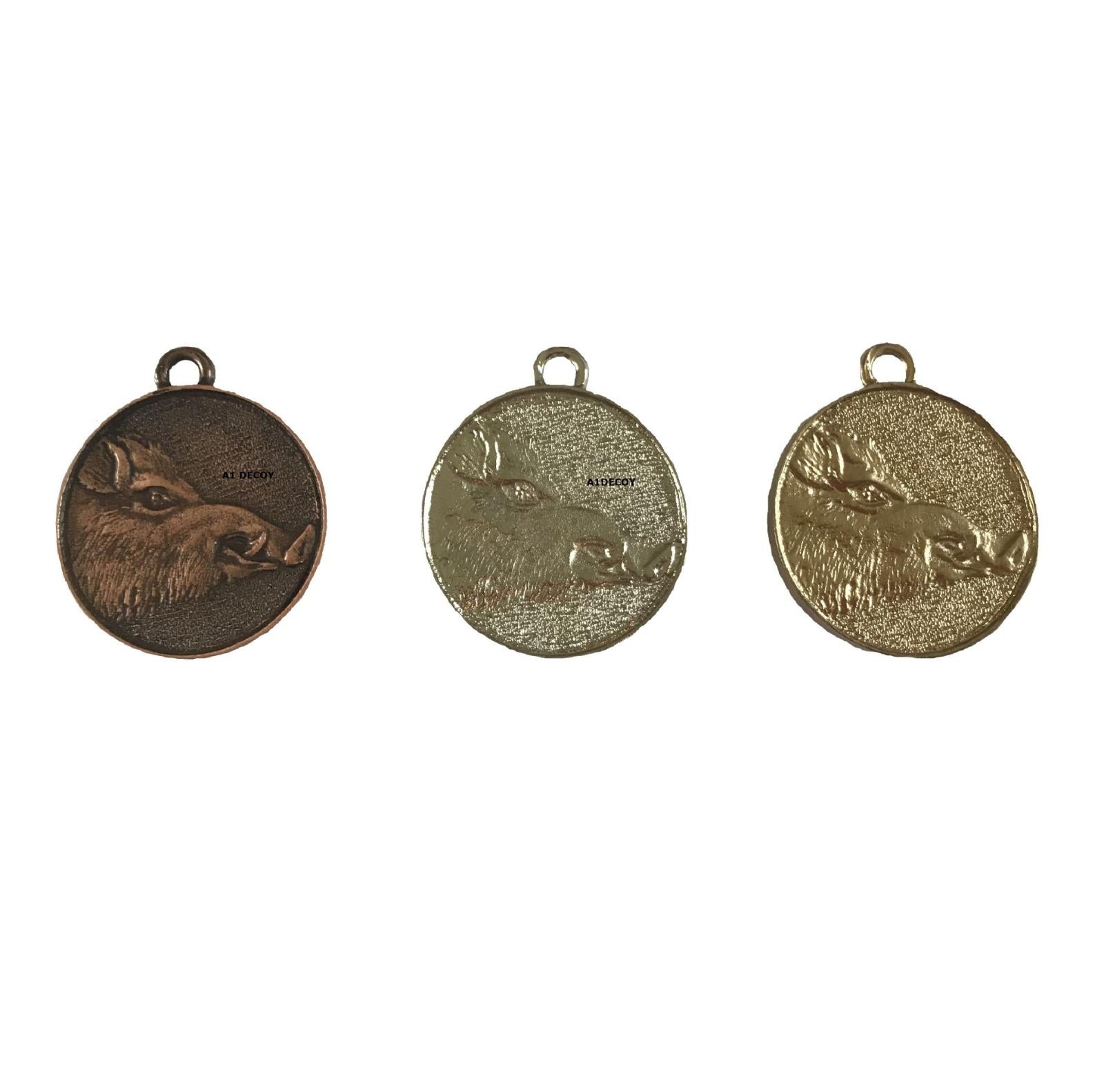 SPJAGD all boar trophy medals in bronze, silver, and gold with engraved boar design, displayed on a neutral background.