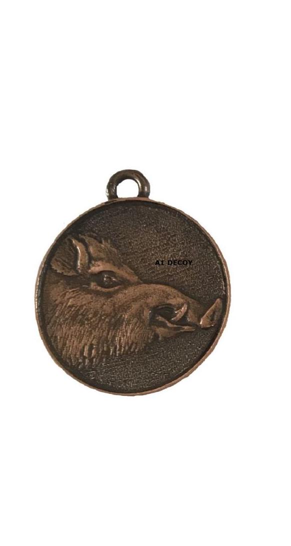 SPJAGD all boar trophy medals in bronze, silver, and gold with detailed engravings and ribbon attachments.