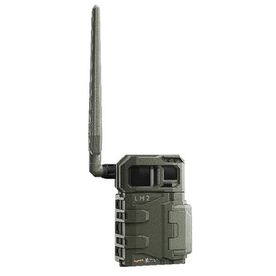 TJACKS SPYPOINT LM2 trail camera mounted outdoors, showcasing its compact design and lens for wildlife monitoring.