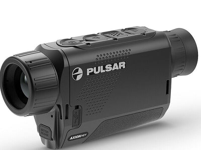 TJACKS Pulsar Axion Key XM30 thermal monocular showing infrared imaging and compact design for outdoor viewing.