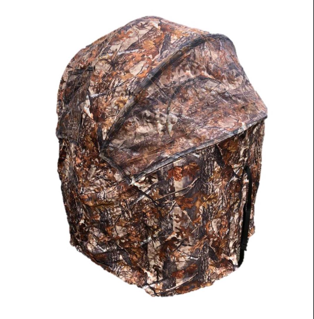 Two-man pop-up hide tent by WINDY, shown set up outdoors with camouflage fabric, ideal for hunting or outdoor activities.