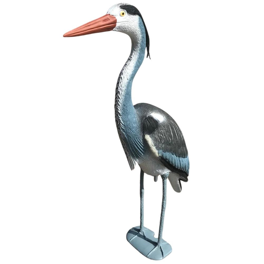 Windy heron decoy garden ornament and predator deterrent, realistic bird decoy for wildlife protection in outdoor gardens.